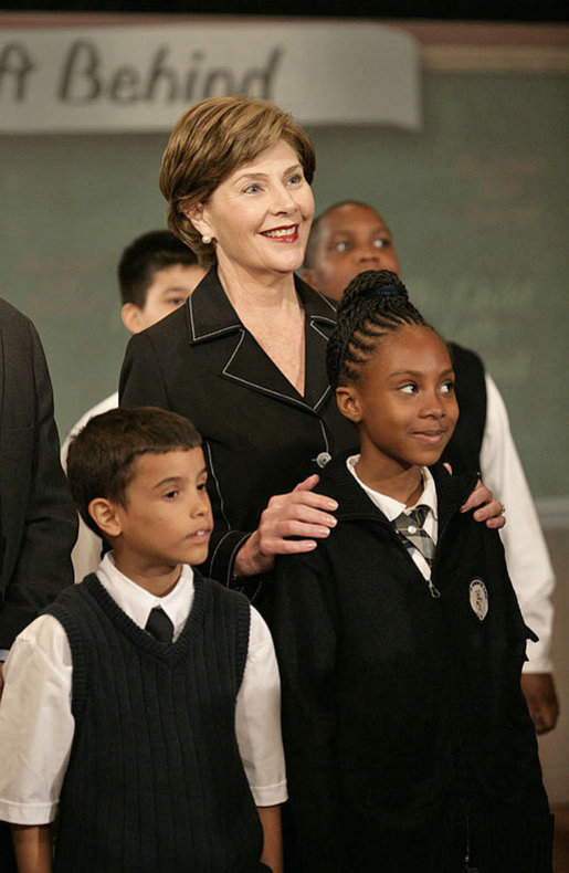 Mrs. Laura Bush stands with students from New York Public School 76 during the President’s statement regarding No Child Left Behind Wednesday, Sept. 26, 2007, in New York. White House photo by Eric Draper