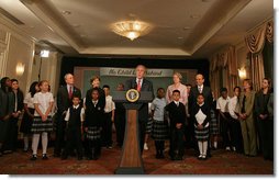 President George W. Bush discusses the reauthorization of No Child Left Behind Wednesday, Sept. 26, 2007, in New York. Those standing with President Bush include New York Mayor Michael Bloomberg, far left, Mrs. Laura Bush and students from New York Public School 76. "The No Child Left Behind Act is working. I say that because the Nation's Report Card says it's working," said President Bush. "Scores are improving, in some instances hitting all-time highs." White House photo by Eric Draper