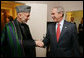 President George W. Bush welcomes Afghanistan President Hamid Karzai to a meeting at the Waldorf Astoria Hotel Wednesday morning, Sept. 26, 2007 in New York. The two leaders met following their participation in meetings at the United Nations. White House photo by Eric Draper