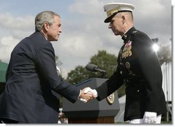 President George W. Bush and outgoing Joint Chiefs of Staff Chairman U.S. Marine General Peter Pace shake hands during the Armed Forces farewell tribute in honor of General Pace and the Armed Forces hail in honor of the new Joint Chiefs of Staff Chairman Navy Admiral Michael Mullen, Monday, October 1, 2007 at Fort Myer, Virginia. General Pace is retiring after serving two years as chairman and 40 years in the U.S. Marines. White House photo by Eric Draper