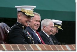 President George W. Bush attends an Armed Forces farewell tribute in honor of Marine General Peter Pace, left, and Armed Forces hail in honor of Navy Admiral Michael Mullen, far right, joined by Secretary of Defense Robert Gates, Monday, October 1, 2007 at Fort Myer, Virginia. General Pace is retiring after serving two years as Chairman and four years as Vice Chairman of the Joint Chiefs of Staff. White House photo by David Bohrer