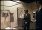 Mrs. Laura Bush looks at a dress worn by Jacqueline Kennedy during a tour of the exhibit First Ladies: Political Role and Public Image at the National Constitution Center Monday, Oct. 1, 2007, in Philadelphia. White House photo by Shealah Craighead