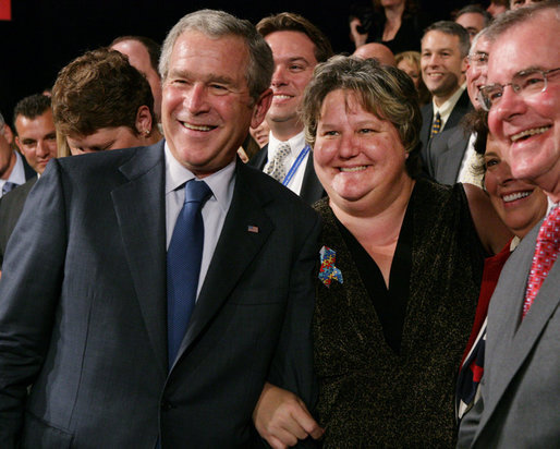 President George W. Bush stands with Karen Woodings of the Central Pennsylvania Food Bank following his address to the Lancaster Chamber of Commerce and Industry at the Jay Group Inc., Wednesday, Oct. 3, 2007 in Lancaster, Pa. President Bush joked with Woodings during the question and answer segment of his visit when she became nervous asking him a question. White House photo by Chris Greenberg