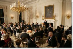 President George W. Bush welcomes guests to the Iftaar Dinner with Ambassadors and Muslim leaders in the State Dining Room of the White House, Thursday, Oct. 4, 2007. White House photo by Chris Greenberg