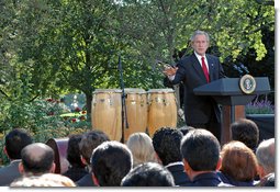 President George W. Bush delivers remarks during a celebration of Hispanic Heritage Month Wednesday, Oct. 10, 2007, in the Rose Garden. “Hispanic Americans strengthen our nation with their commitments to familia y fe (family and faith),” said the President. “Hispanic Americans enrich our country with their talents and creativity and hard work. Hispanic Americans are living the dream that has drawn millions to our shores -- and we must ensure that the American Dream remains available for all.” White House photo by Grant Miller