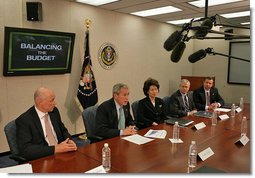 President George W. Bush meets with his economic advisors Thursday, Oct. 11, 2007, in the New Executive Office Building in Washington, D.C. "The deficit today is at 1.2 percent of GDP, which is lower than the average of the last 40 years. In other words, we have told the American people that by keeping taxes low we can grow the economy, and by working with Congress to set priorities we can be fiscally responsible and we can head toward balance," said President Bush in a statement to the press. "And that's exactly where we're headed." White House photo by Chris Greenberg