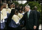 President George W. Bush meets with members of the Ballou High School Marching Band of Washington, D.C., following a photo with the band on the South Portico of the White House Thursday, Oct. 11, 2007, prior to a screening of Ballou: A Documentary Film, about the band’s inspiring accomplishments for the students and the school. White House photo by Shealah Craighead