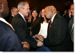 President George W. Bush greets an audience member after delivering remarks on trade policy Friday, Oct. 12, 2007, at the Radisson Miami Hotel in Miami. White House photo by Eric Draper