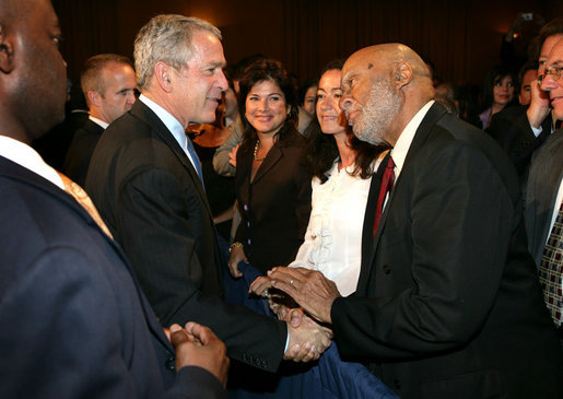 President George W. Bush greets an audience member after delivering remarks on trade policy Friday, Oct. 12, 2007, at the Radisson Miami Hotel in Miami. White House photo by Eric Draper