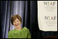 Mrs. Laura Bush smiles as she listens to an introduction by Dr. Ken Ciongoli , chairman of The National Italian American Foundation, during an education luncheon honoring Mrs. Bush with the NIAF Special Achievement Award in Literacy, Friday, Oct. 12, 2007 in Washington, D.C. In thanking the organization Mrs. Bush emphasized the many contributions that Italian-Americans have made in the education of our nation’s youth. White House photo by Shealah Craighead