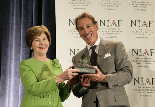 Mrs. Laura Bush is presented with The National Italian American Foundation’s Special Achievement Award in Literacy from NIAF Chairman Dr. Ken Ciongoli, Friday, Oct. 12, 2007, in Washington, D.C. White House photo by Shealah Craighead