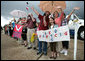 Well-wishers wave and show their support for President George W. Bush at his departure aboard Air Force One Monday, Oct. 15, 2007, from Waco TSTC Airport in Waco, Texas. President Bush flew on to Arkansas touring a manufacturing facility, meeting with local business leaders and delivering a speech on fiscal responsibility. White House photo by Eric Draper