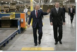 President George W. Bush tours the Stribling Packaging Inc., Monday, Oct. 15, 2007 in Rogers, Ark., with company President Bill Stribling. The facility specializes in the design of corrugated boxes and point-of-purchase displays. President Bush later met for lunch with local business leaders and delivered an address on fiscal responsibility. White House photo by Eric Draper