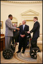 President George W. Bush talks with wounded veterans Sgt.Kortney Clemons, left, of Little Rock, Miss., and Sgt. Ryan Groves of Kent, Ohio, who both use a Segway as a mobility device, on a visit to the Oval office Tuesday, Oct. 16, 2007, attending a meeting of the President's Commission on Care for America's Returning Wounded Warriors. White House photo by Eric Draper