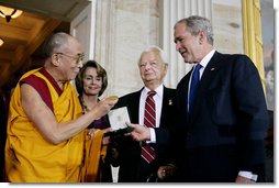 President George W. Bush, joined by U.S. Senator Robert Byrd and House Speaker Nancy Pelosi, presents the Congressional Gold Medal to The Dalai Lama at a ceremony Wednesday, Oct. 17, 2007 at the U.S. Capitol in Washington, D.C. White House photo by Chris Greenberg