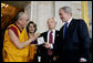 President George W. Bush, joined by U.S. Senator Robert Byrd and House Speaker Nancy Pelosi, presents the Congressional Gold Medal to The Dalai Lama at a ceremony Wednesday, Oct. 17, 2007 at the U.S. Capitol in Washington, D.C. White House photo by Chris Greenberg