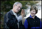 President George W. Bush and Mrs. Laura Bush have a close look at a screech owl Saturday, Oct. 20, 2007 at the Patuxent Research Refuge in Laurel, Md., where President Bush discussed steps his Administration is creating for a series of cooperative conservation steps to preserve and restore critical stopover habitat for migratory birds in the United States. White House photo by Eric Draper