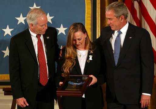 President George W. Bush stands with Dan and Maureen Murphy, parents of Lt. Michael P. Murphy, after the Navy SEAL was honored posthumously with the Medal of Honor during ceremonies Monday, Oct. 22, 2007, in the East Room of the White House. White House photo by Joyce N. Boghosian