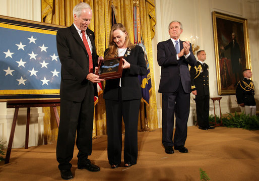 President George W. Bush leads the applause after presenting Dan and Maureen Murphy with the Medal of Honor in honor of their son, Navy Lt. Michael P. Murphy, who died in action during service in support of Operation Enduring Freedom in 2005. White House photo by David Bohrer