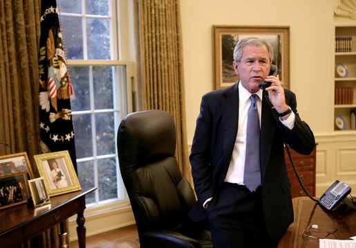 President George W. Bush speaks with California Gov. Arnold Schwarzenegger Monday, Oct. 22, 2007, regarding the wildfires burning throughout the Southern California area. White House photo by Eric Draper