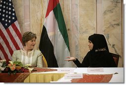 Mrs. Laura Bush talks with Basmah Zeyoudi during a roundtable discussion with young Arab women leaders Monday, Oct. 22, 2007, in Abu Dhabi, United Arab Emirates. Moderating the discussion is U.S. Ambassador Michele Sison. White House photo by Shealah Craighead