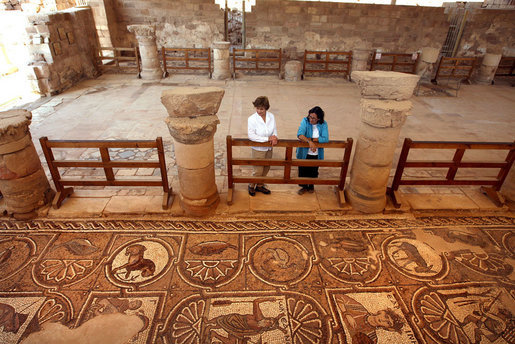 Mrs. Laura Bush tours the Petra Church with Dr. Barbara Porter, Director of the American Center for Oriental Research, during a walk through the ancient city that included homes, a temple, an amphitheater and royal tombs. The church was discovered in 1973 by an American archeologist. It's estimated that the church was built in the fifth century and included three apses. The mosaic tile covered both church's side aisles. White House photo by Shealah Craighead