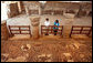 Mrs. Laura Bush tours the Petra Church with Dr. Barbara Porter, Director of the American Center for Oriental Research, during a walk through the ancient city that included homes, a temple, an amphitheater and royal tombs. The church was discovered in 1973 by an American archeologist. It's estimated that the church was built in the fifth century and included three apses. The mosaic tile covered both church's side aisles. White House photo by Shealah Craighead