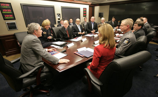 President George W. Bush, joined by Frances Fragos Townsend, Assistant to the President for Homeland Security and Counterterrorism, right; Homeland Security Secretary Michael Chertoff, center-left; and Mike McConnell, Director of National Intelligence, second from left, addresses participants at a meeting on National Strategy for Information Sharing at the White House, Wednesday, Oct. 31, 2007. White House photo by Eric Draper