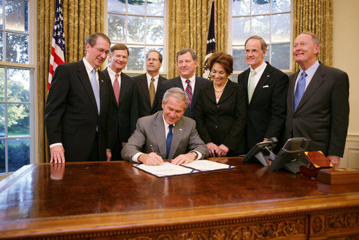 President George W. Bush signs H.R. 3678 the Internet Tax Freedom Act Amendments Act of 2007, Wednesday, Oct. 31, 2007 in the Oval Office, joined by from left, Rep. Bob Goodlatte of Virginia, Rep. Lamar Smith of Texas, Sen. John Sununu of New Hampshire, Rep. Chris Cannon of Utah, Rep. Anna Eshoo of California, Sen. Tom Carper of Delaware and Sen. Lamar Alexander of Tennessee. White House photo by Eric Draper