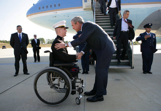 President George W. Bush greets Marine Corps Lt. Andrew Kinard, a 24-year-old from Spartanburg, S.C., after arriving Friday, Nov. 2, 2007, at Columbia Metropolitan Airport in Columbia, S.C. The Marine was wounded in 2006 while serving in Iraq. White House photo by Eric Draper