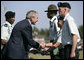 President George W. Bush shakes hands with recipients of outstanding soldier awards during the Basic Combat Training Graduation Ceremonies Friday, Nov. 2, 2007, at Fort Jackson in Columbia, S.C. Fort Jackson is the largest and most active Initial Training Center in the U.S. Army, training an average of 50,000 soldiers per year. White House photo by Eric Draper