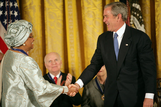 President George W. Bush awards the Presidential Medal of Freedom to Liberian President Ellen Johnson Sirleaf during a ceremony Monday, Nov. 5, 2007, in the East Room. "When free elections returned to Liberia, the voters made history," said President Bush. "They chose her to be the first woman ever elected to lead a nation on the continent of Africa." White House photo by Eric Draper