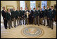 President George W. Bush stands with members of the U.S. Walker Cup in the Oval Office during their visit Monday, Nov. 5, 2007, to the White House. Named for the President's great grandfather, George Herbert Walker -- President of the United States Golf Association in 1920 -- the team defeated Great Britain and Ireland this past September to win the 41st Cup match. White House photo by Eric Draper