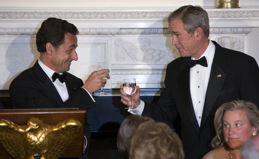 President George W. Bush and President Nicolas Sarkozy of France raise their glasses in toast Tuesday, Nov. 6, 2007, during dinner in the State Dining Room in the honor of the French leader. White House photo by Chris Greenberg