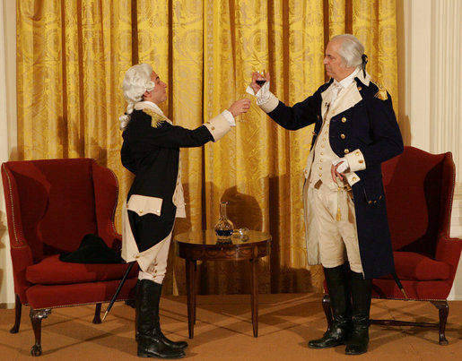 General George Washington (played by Dean Malissa) and General Marie Joseph Paul Yves Roch Gilbert du Motier, the Marquis de LaFayette (played by Benjamin Goldman), toast each other at the beginning of their dialogue Tuesday, Nov. 6, 2007, during the entertainment in the East Room following a dinner in honor of President Nicolas Sarkozy at the White House. White House photo by Chris Greenberg