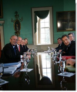 President George W. Bush and President Nicolas Sarkozy of France pause for cameras as they meet in the Large Dining Room at the Mount Vernon Estate in Mount Vernon, Va., Wednesday, Nov. 7, 2007. White House photo by Eric Draper