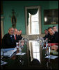 President George W. Bush and President Nicolas Sarkozy of France pause for cameras as they meet in the Large Dining Room at the Mount Vernon Estate in Mount Vernon, Va., Wednesday, Nov. 7, 2007. White House photo by Eric Draper