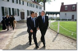 President George W. Bush and President Nicolas Sarkozy of France walk a path from George Washington's mansion during their tour Wednesday, Nov. 7, 2007, of the first president's home. White House photo by Eric Draper