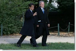 President George W. Bush and President Nicolas Sarkozy share a moment as they walk to a joint press availability Wednesday, Nov. 7, 2007, at Mount Vernon. The tour of the Virginia home of George Washington coincided with a series of meetings by the two leaders during the visit by the French leader to the United States. White House photo by Chris Greenberg