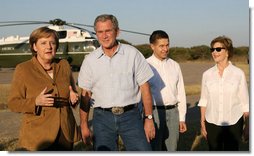 President George W. Bush listens as German Chancellor Angela Merkel thanks President Bush and Mrs. Laura Bush for their weekend invitation to her and her husband, Dr. Joachim Sauer, to the Bush ranch in Crawford, Texas, Friday, Nov. 9, 2007. White House photo by Shealah Craighead