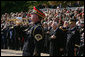 An U.S. Army Band bugler plays Taps during a wreath-laying ceremony at the Tomb of the Unknown Soldier, Sunday, Nov. 11, 2007, at Arlington National Cemetery in Arlington, Va. White House photo by David Bohrer