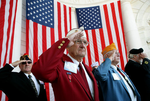 Veteran Warren G. King, Sr. of Nashville, center, salutes with fellow veterans Sunday, Nov. 11, 2007, during Veterans Day ceremonies at Arlington National Cemetery in Arlington, Va. White House photo by David Bohrer