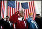 Veteran Warren G. King, Sr. of Nashville, center, salutes with fellow veterans Sunday, Nov. 11, 2007, during Veterans Day ceremonies at Arlington National Cemetery in Arlington, Va. White House photo by David Bohrer