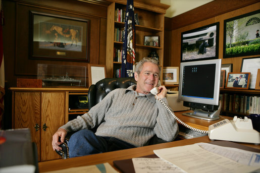 President George W. Bush talks to troops from Camp David, Thanksgiving Day, Thursday, Nov. 22, 2007. The President phoned members of the Armed Forces who are stationed overseas to wish them a happy Thanksgiving and thank them for their service to our Nation. White House photo by Eric Draper