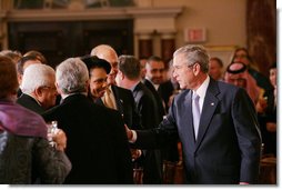 President George W. Bush speaks with U.S. Secretary of State Condoleezza Rice, center, joined by Palestinian President Mahmoud Abbas, left, and Israeli Prime Minister Ehud Olmert, following President Bush’s address at the Secretary of State’s Dinner Monday evening, Nov. 26, 2007 at the State Department in Washington, D.C., welcoming the participants attending the Annapolis Conference. White House photo by Chris Greenberg