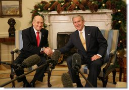 President George W. Bush shakes hands with Prime Minister Ehud Olmert of Israel in the Oval Office Monday, Nov. 26, 2007. In welcoming his fellow leader to the White House, the President said, "Thanks for coming to the Annapolis Conference. I'm looking forward to continuing our serious dialogue with you and the President of the Palestinian Authority to see whether or not peace is possible. I'm optimistic, I know you're optimistic, and I want to thank you for your courage and your friendship." White House photo by Eric Draper