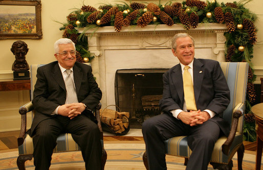 President George W. Bush and President Mahmoud Abbas of the Palestinian Authority meet in the Oval Office of the White House Monday, Nov. 26, 2007. In welcoming his fellow leader to the White House, President Bush said, "Thank you for coming, and thank you for working hard to implement a vision for a Palestinian state. We want the people in the Palestinian Territories to have hope. And we thank you for your willingness to sit down with Israel to negotiate the settlement." White House photo by Eric Draper