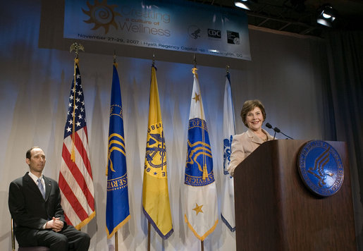 After being introduced by Health and Human Services Deputy Secretary Tevi Troy (pictured at left), Mrs. Laura Bush addresses the 2007 National Prevention and Health Promotion Summit Tuesday, Nov. 27, 2007, in Washington, D.C. "Poor health takes an enormous toll on our economy. Sick workers cost businesses millions of dollars in lost productivity," said Mrs. Bush. "The private sector, and government, pay even more in insurance and health care costs. Medical treatment for chronic diseases costs $1.5 trillion dollars a year." White House photo by Shealah Craighead