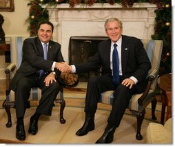 President George W. Bush and President Elias Antonio Saca meet with the media Thursday, Nov. 29, 2007, during the El Salvadoran President's visit to the White House. President Bush told his fellow leader, "I want to thank the people of El Salvador for being such strong supporters in the war against extremists and radicals. I appreciate the sacrifice of your troops, Mr. President, and their families, as we work jointly to help others realize the blessings of liberty and freedom, particularly in Iraq." White House photo by Eric Draper