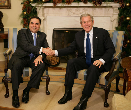 President George W. Bush and President Elias Antonio Saca meet with the media Thursday, Nov. 29, 2007, during the El Salvadoran President's visit to the White House. President Bush told his fellow leader, "I want to thank the people of El Salvador for being such strong supporters in the war against extremists and radicals. I appreciate the sacrifice of your troops, Mr. President, and their families, as we work jointly to help others realize the blessings of liberty and freedom, particularly in Iraq." White House photo by Eric Draper